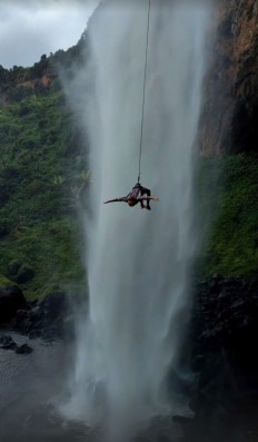 Absailing down a waterfall in Uganda